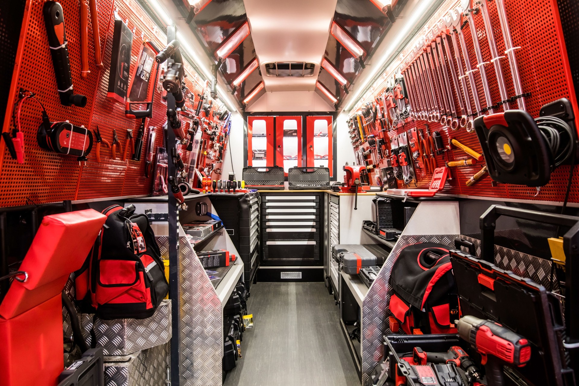 Mobile auto service truck with various tools and devices inside