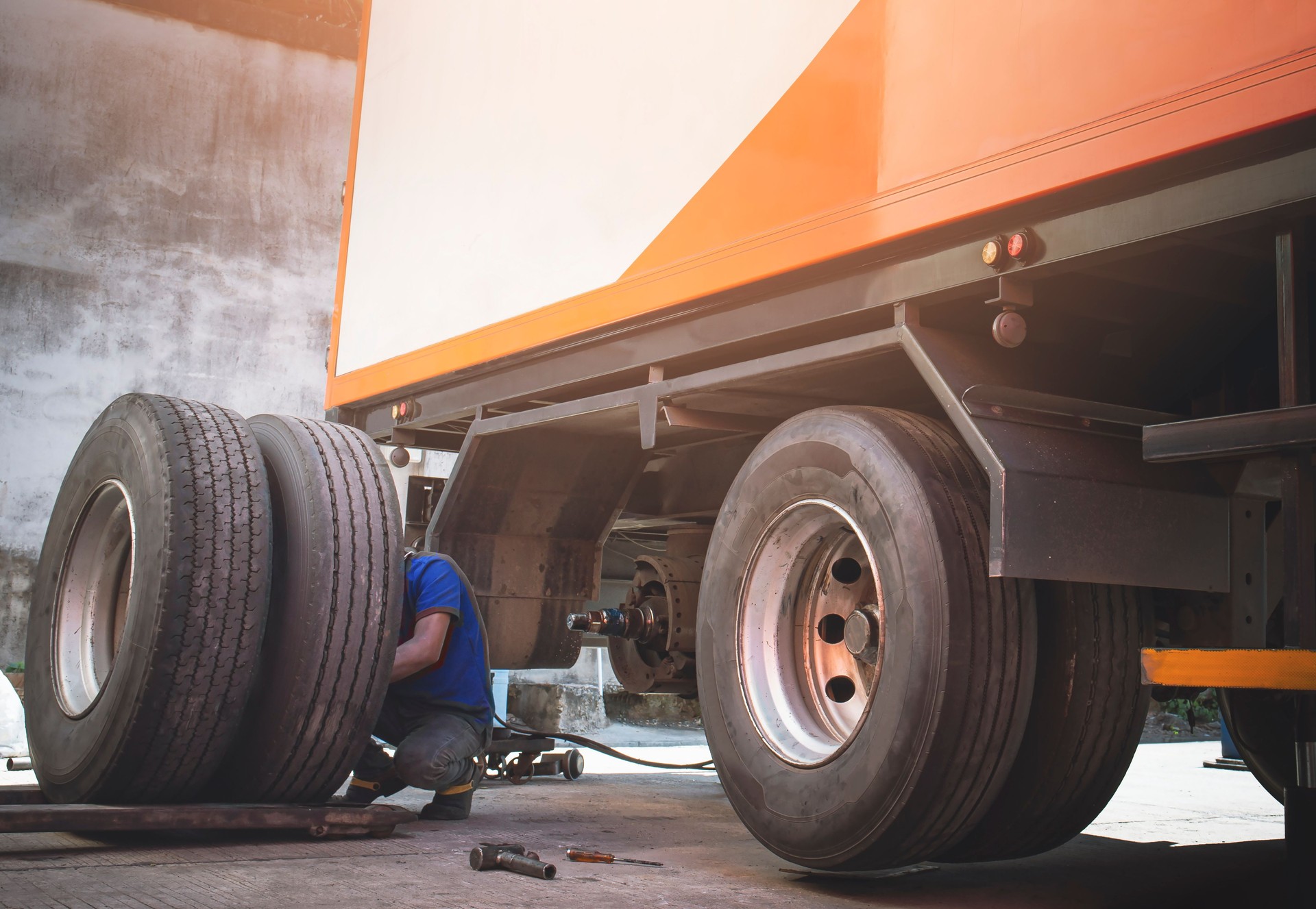 A Big Truck Wheels and Tires. Truck Spare Wheels Tyre Waiting For to Change. Trailer Maintenace and Repairing.